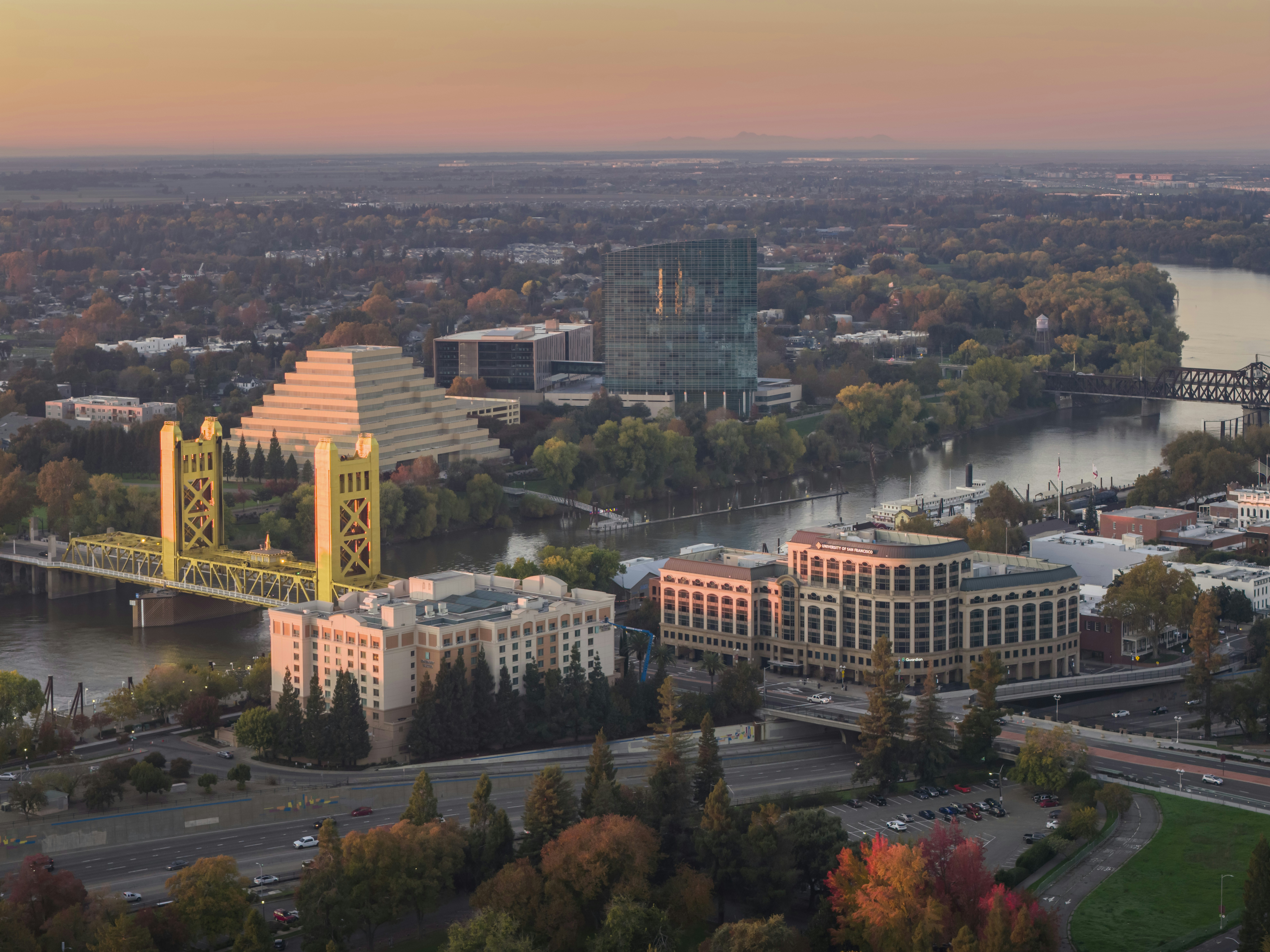 Aerial view of a city skyline at sunset