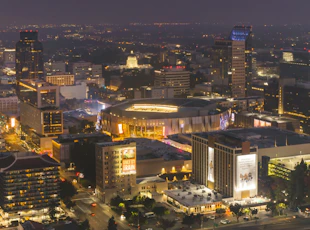 Vibrant cityscape with a stadium at night