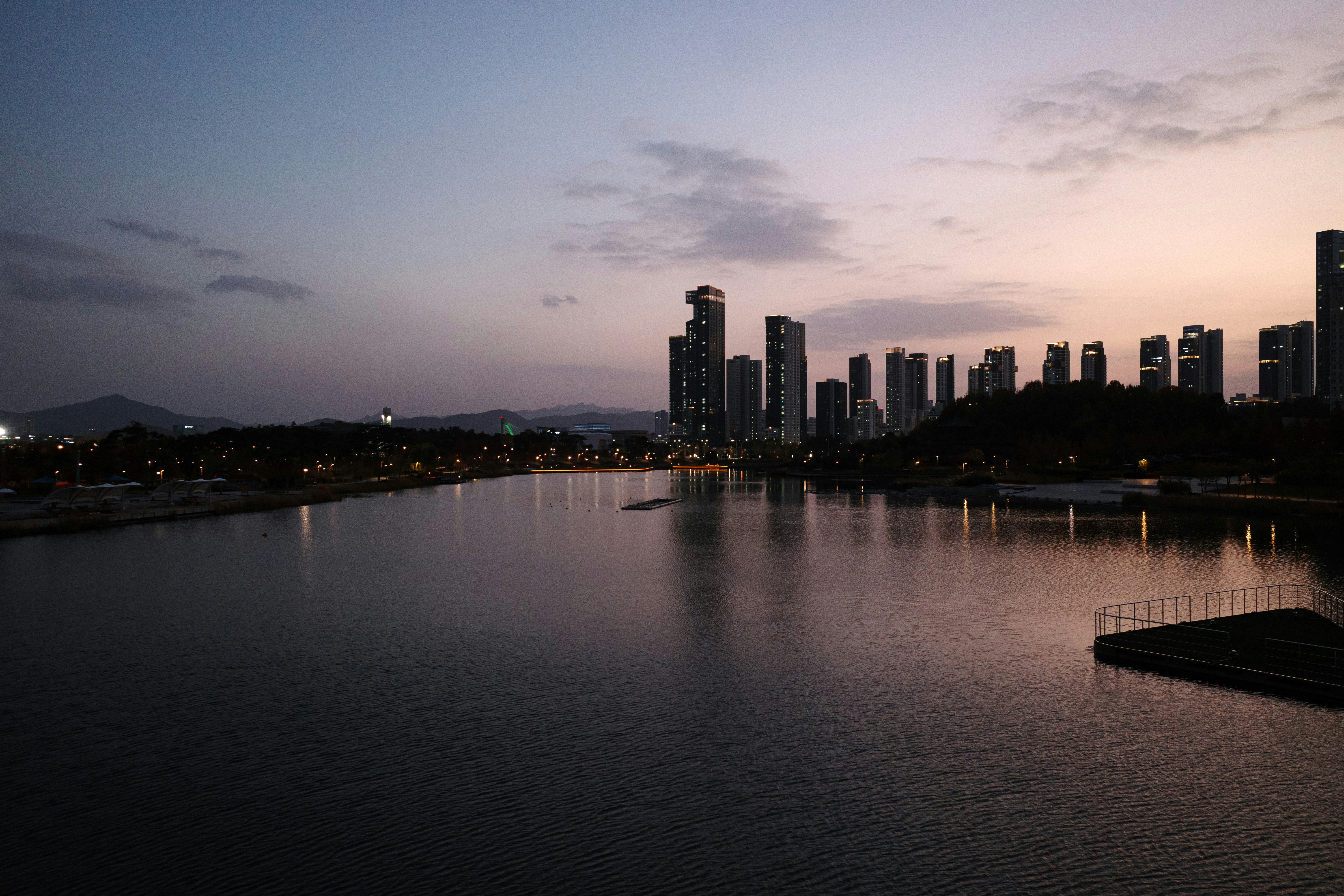 City skyline reflected in water at dusk
