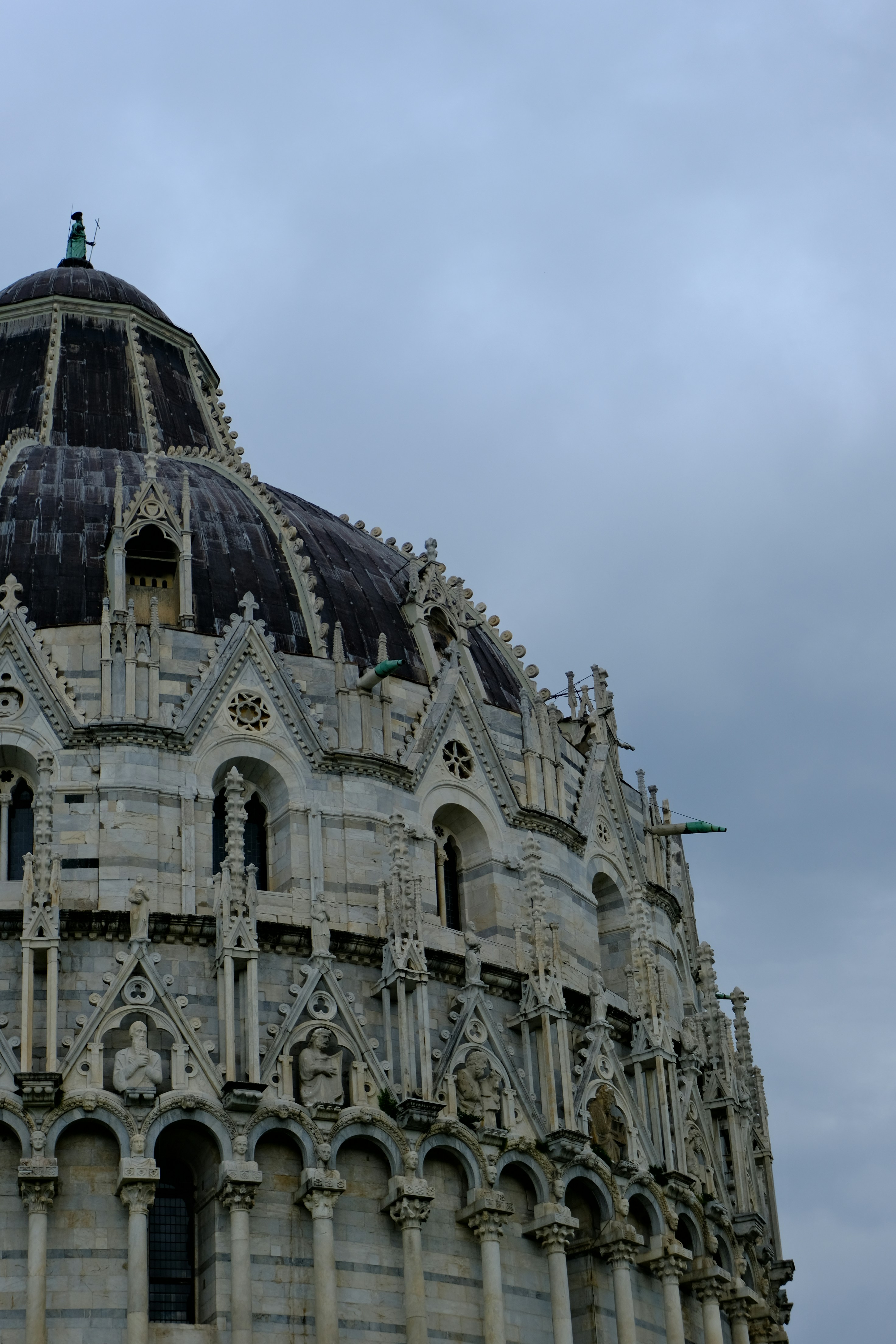 Ornate marble building with a domed roof.