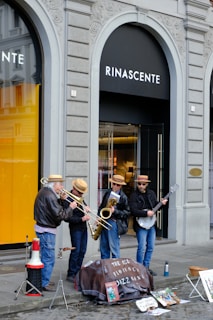 Musicians play jazz on a city street.