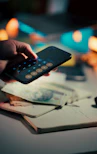 Small business owner calculating payment amounts showing how important it is to get paid quickly