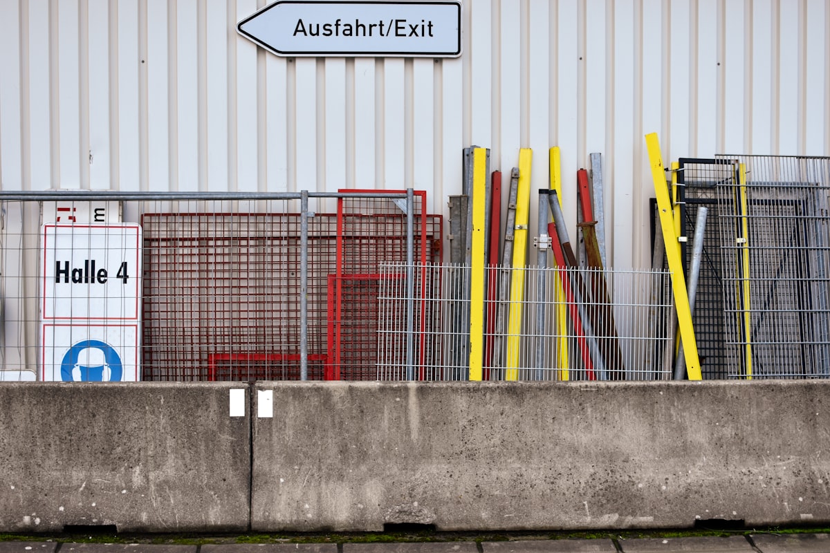 Construction workers assembling a modular steel warehouse frame