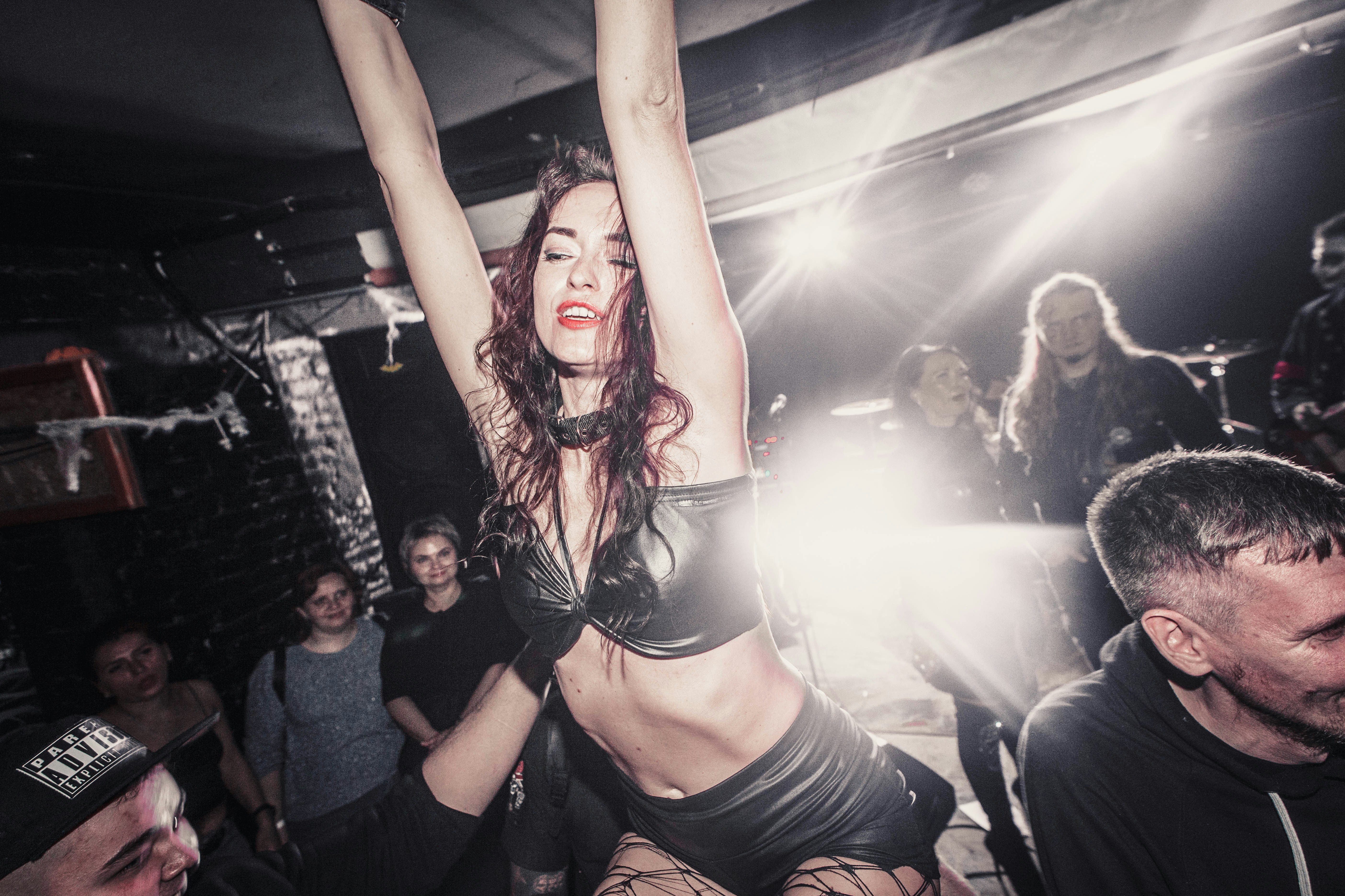 Woman dancing on shoulders at a concert