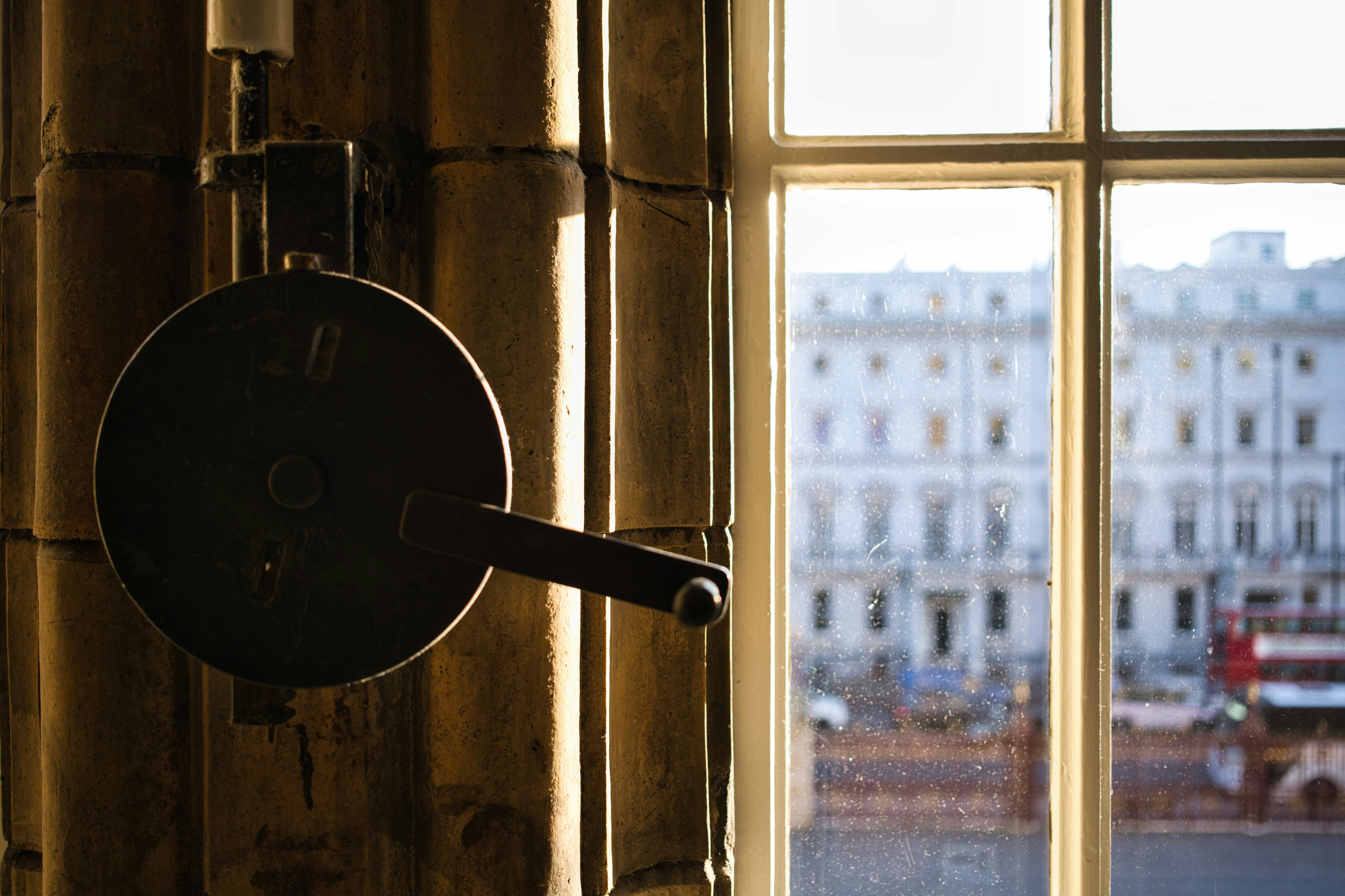 Antique mechanism near window with city view