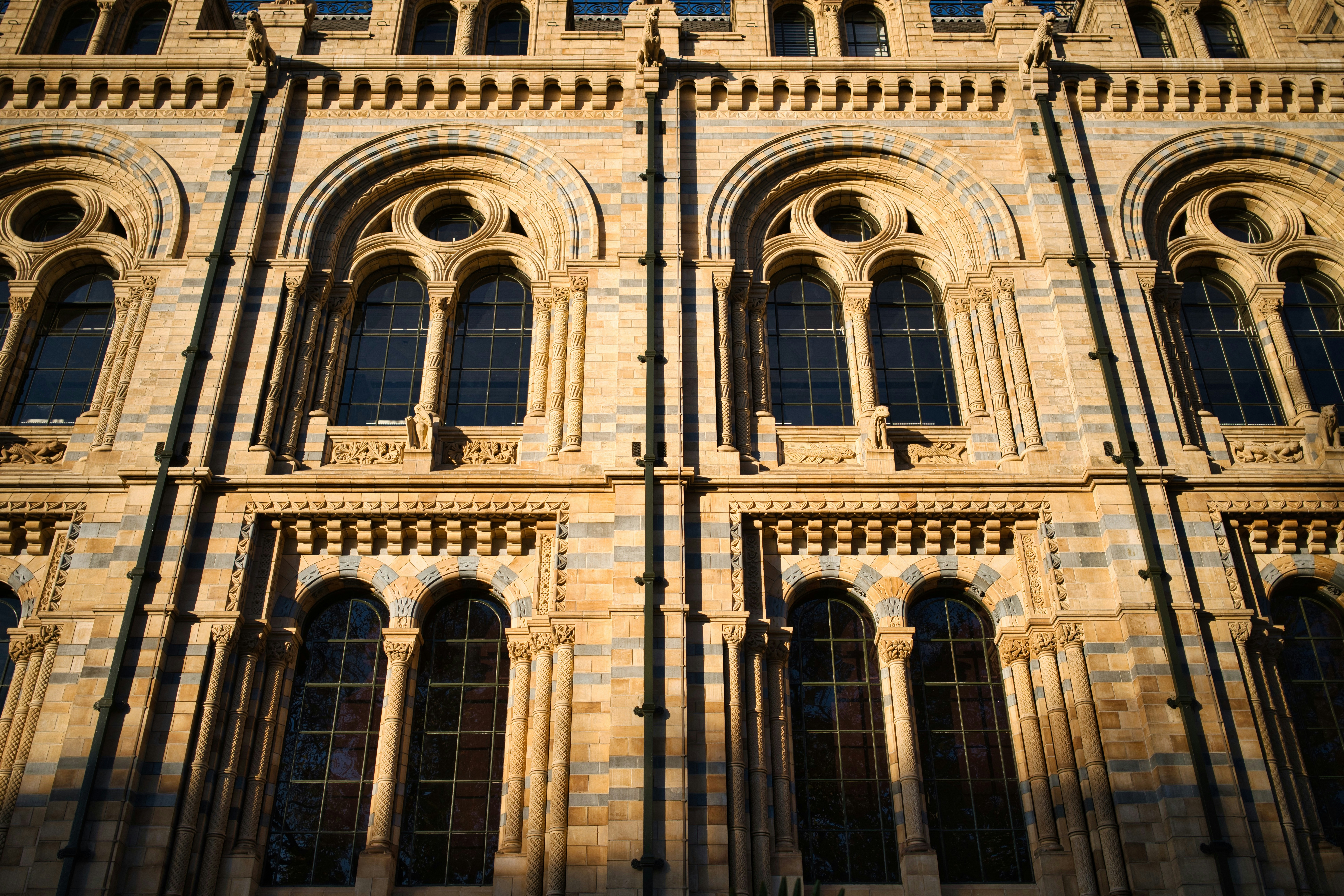 Ornate stone facade with arched windows and decorative carvings.