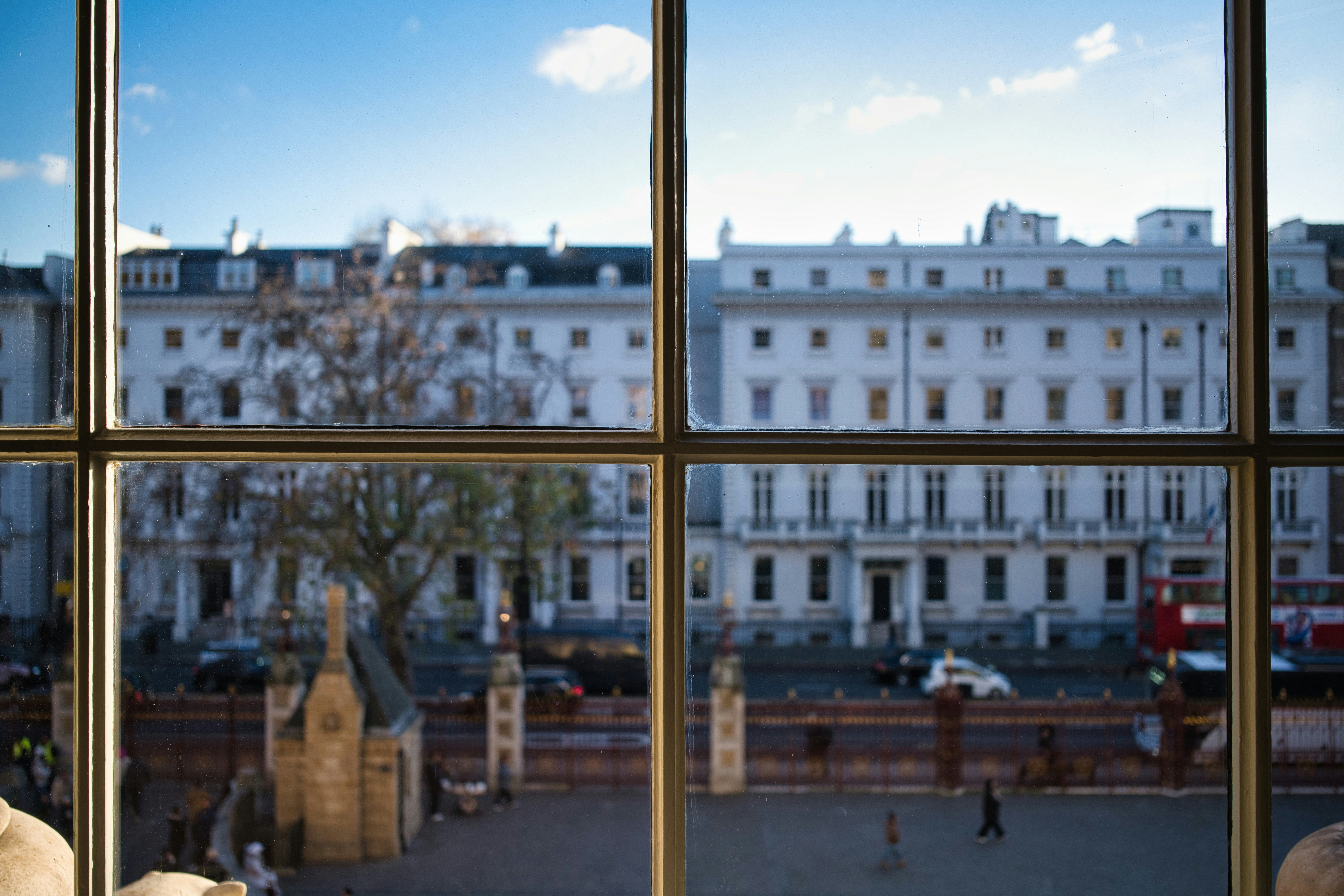 View of white buildings through a window