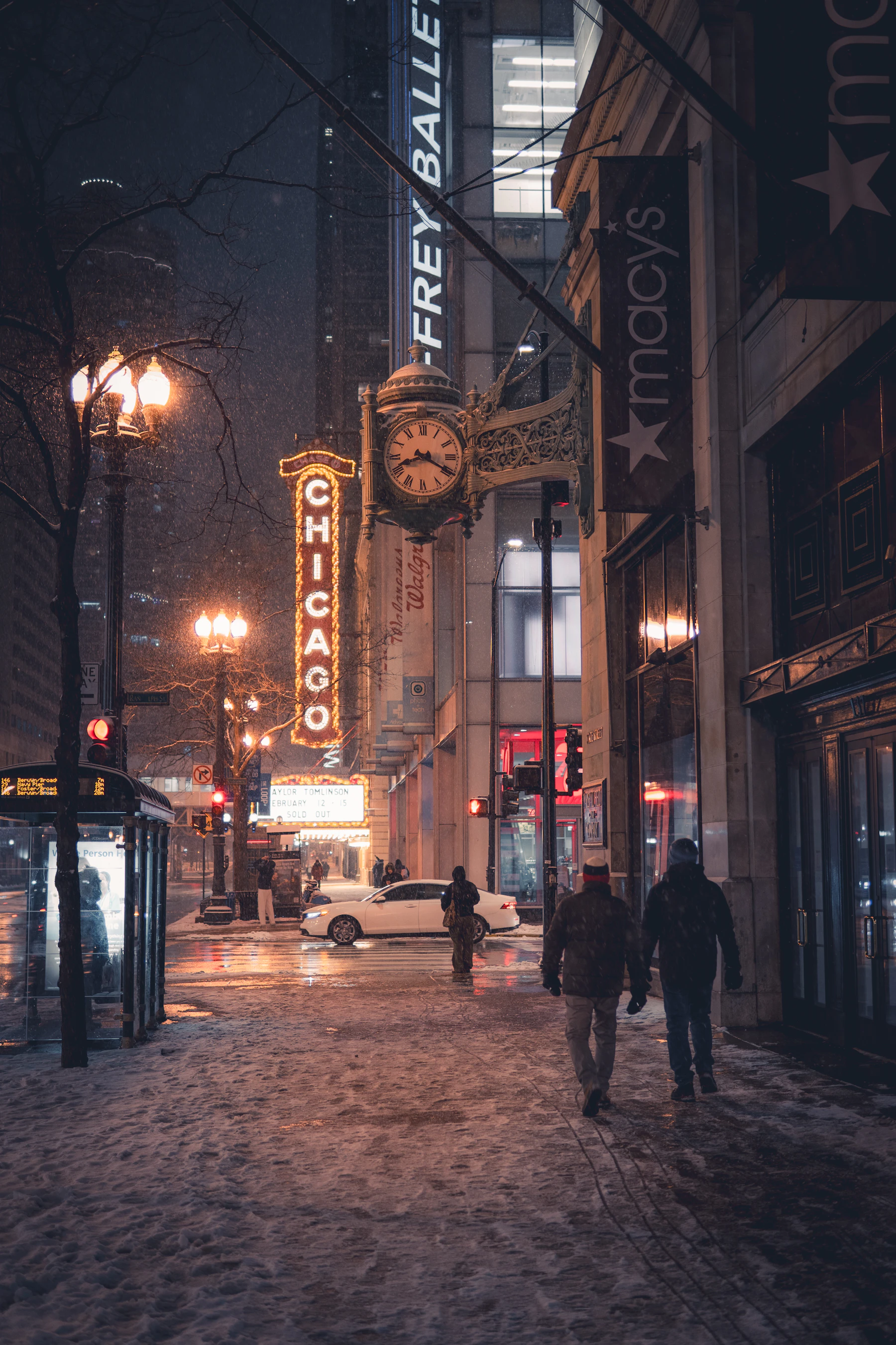 A snowy Chicago street at night