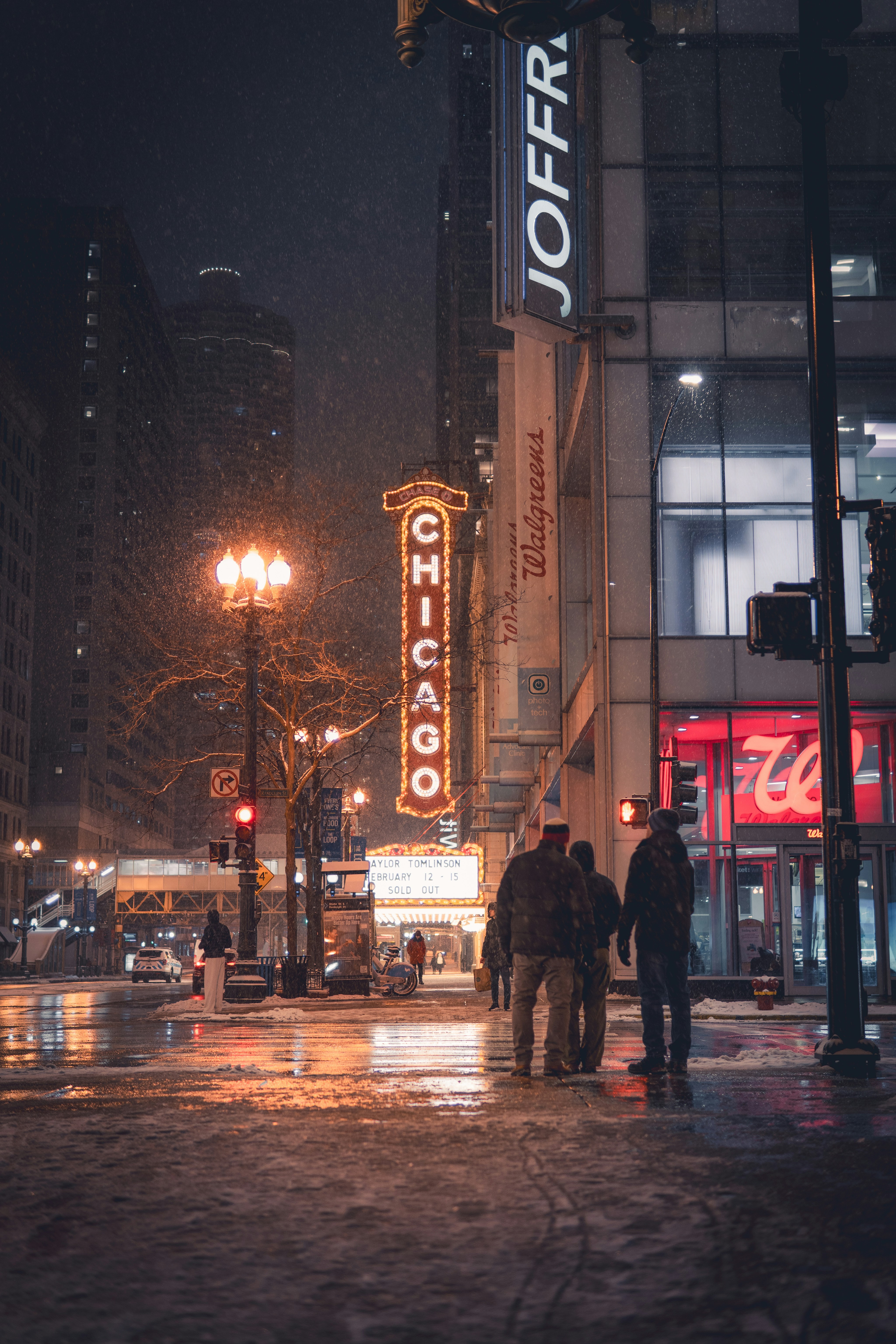 Chicago theater district at night during snowfall