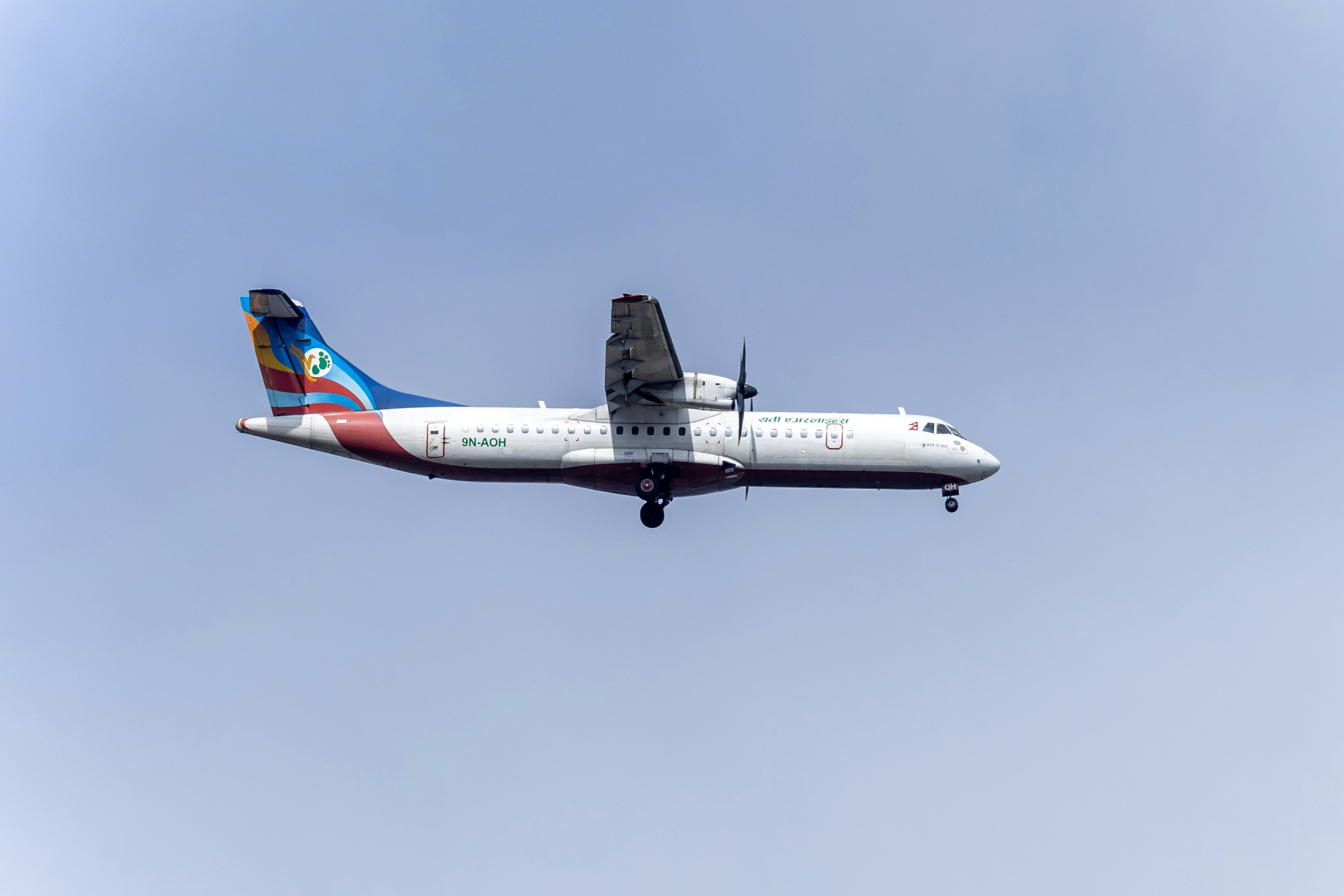 Domestic Airplane Flying Across the Nepal Sky