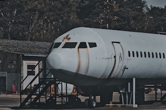 Abandoned airplane fuselage with rusty markings