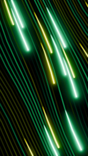 Abstract streaks of green and yellow light.