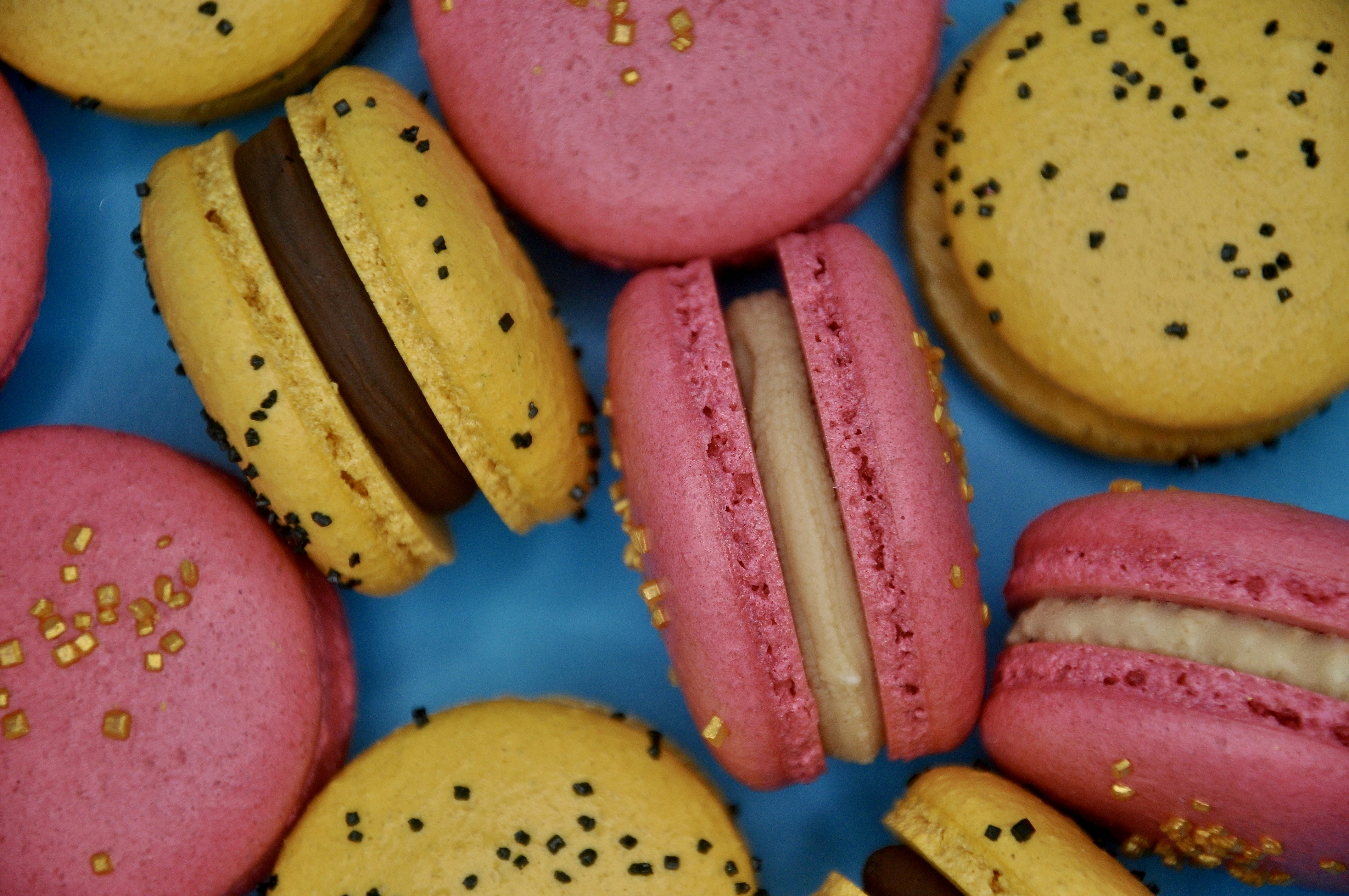 Colorful macarons with chocolate and cream filling.