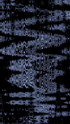 Abstract pattern of wavy lines on black background