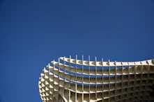 Modern architectural structure against a clear blue sky