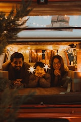Family in camper van decorated for christmas