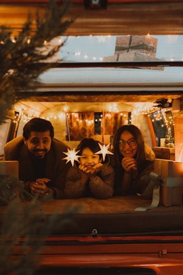 Family in camper van decorated for christmas