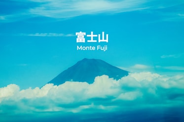 Mount fuji peeking through clouds under blue sky