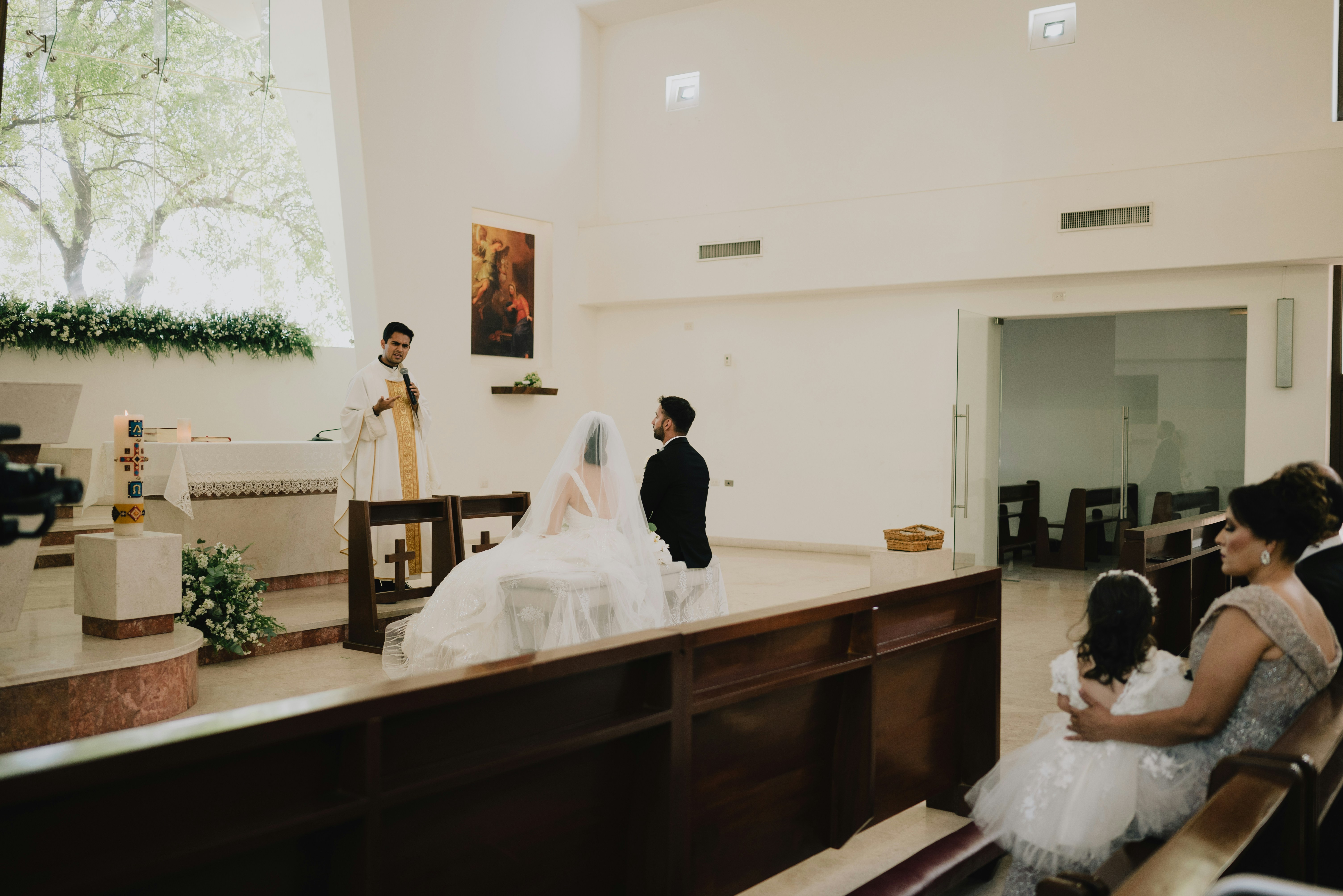 Wedding ceremony in a church with bride and groom.