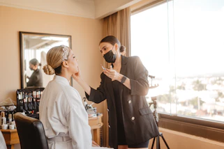 Makeup artist applying makeup to a woman