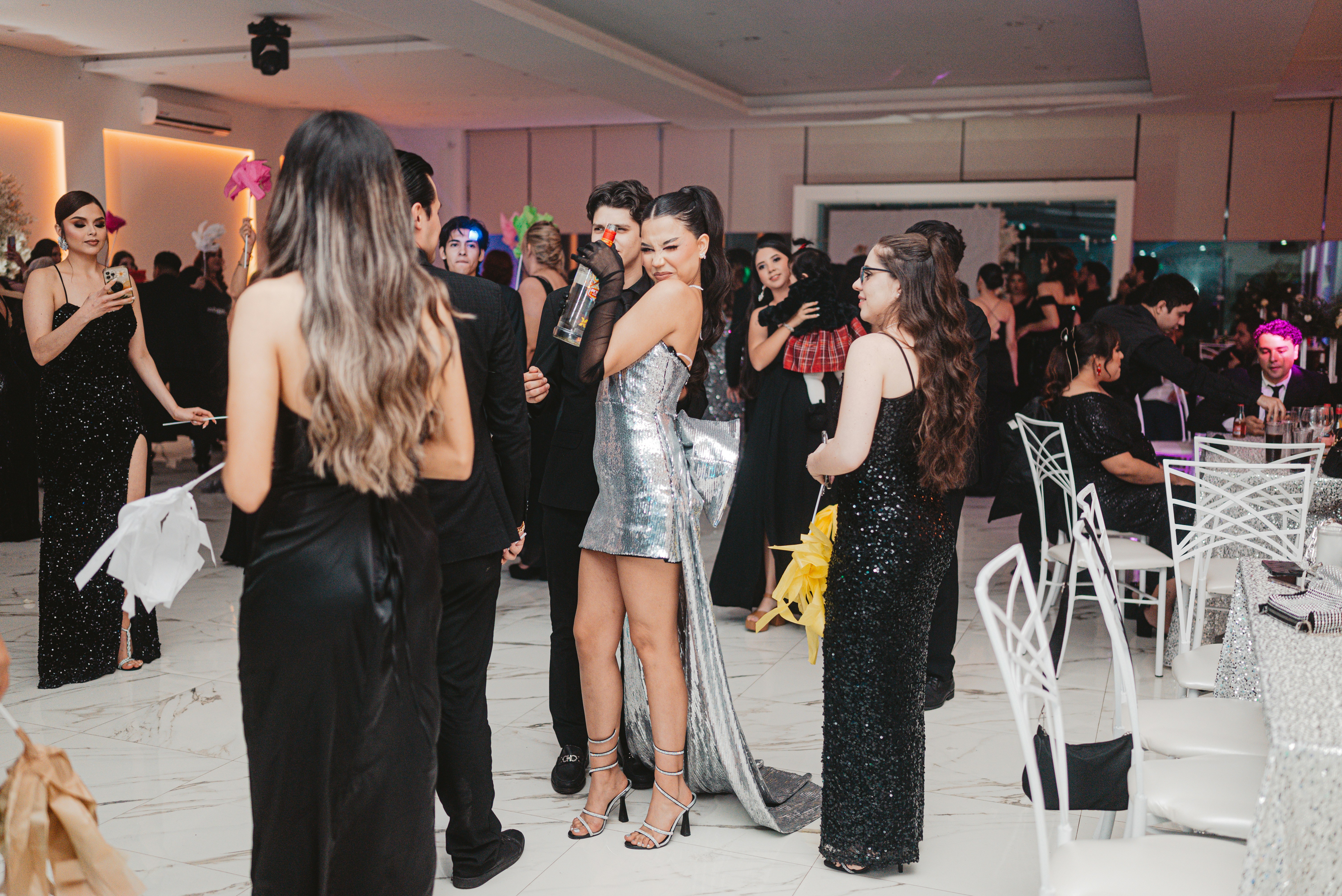 People in formal attire at a glamorous event