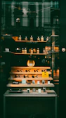 Display of pipes and lighters in a shop window.