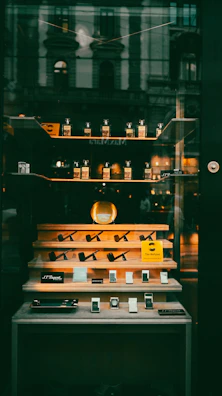 Display of pipes and lighters in a shop window.
