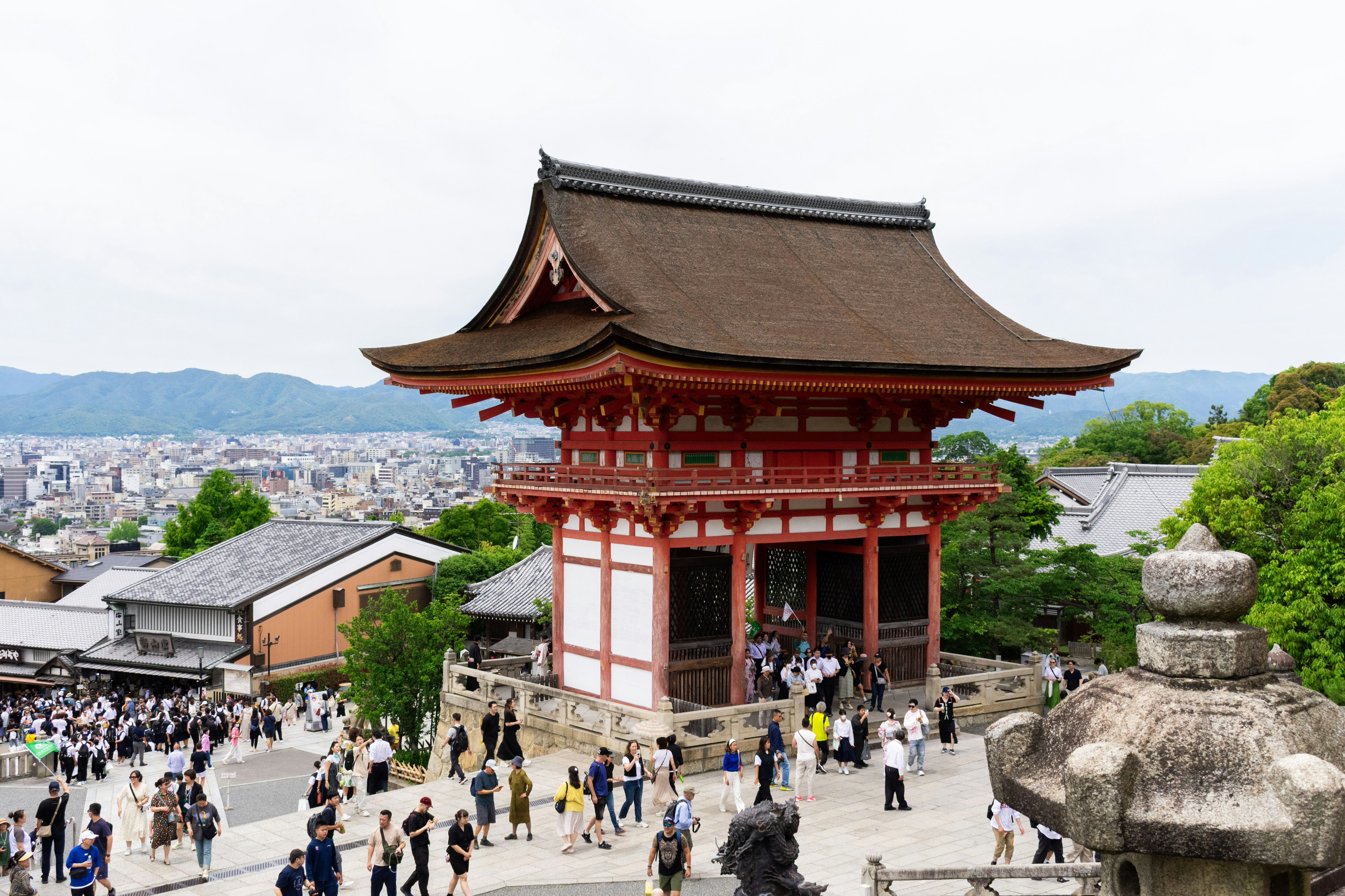 Crowded temple complex with traditional japanese architecture