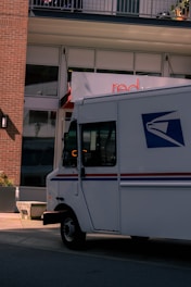 Usps mail truck driving on street