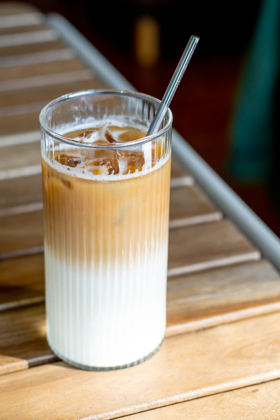 Layered iced latte in a tall glass