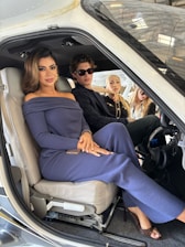 Four people sitting inside a small aircraft