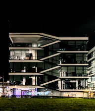 Modern office building at night with illuminated windows