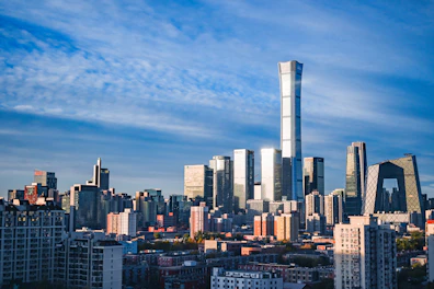 Modern skyscrapers under a cloudy blue sky