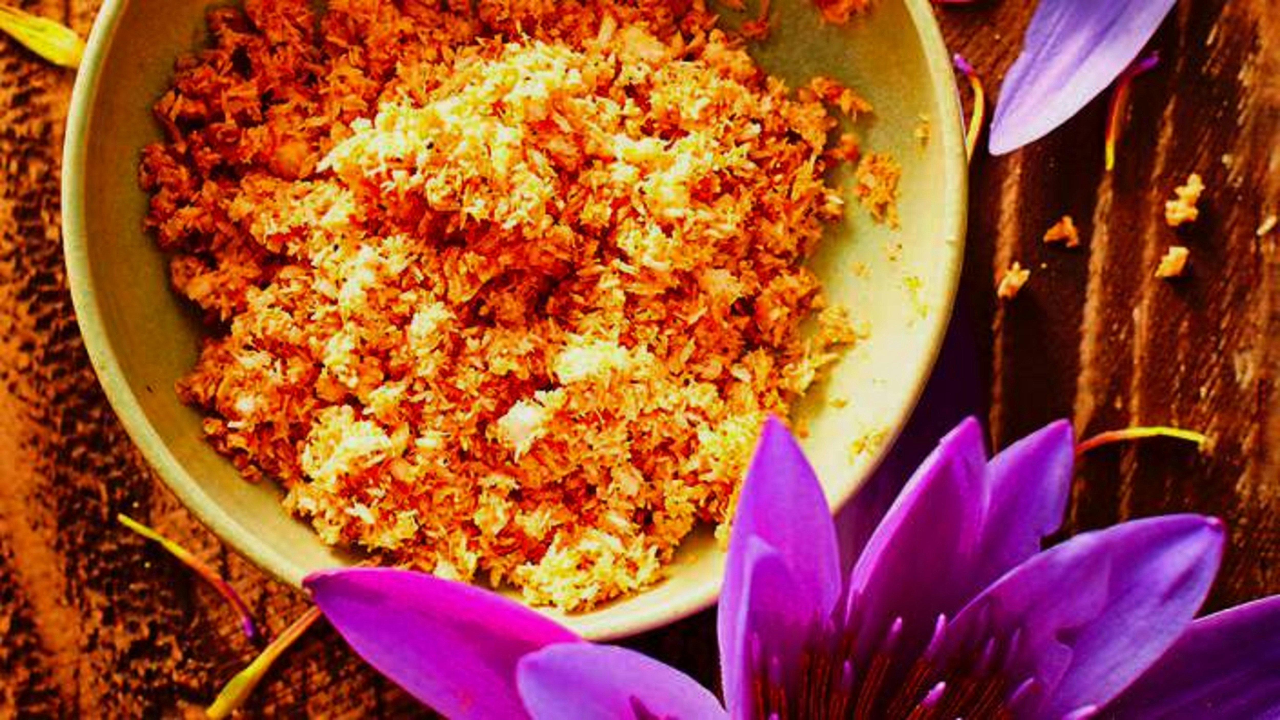 Bowl of food with purple flowers
