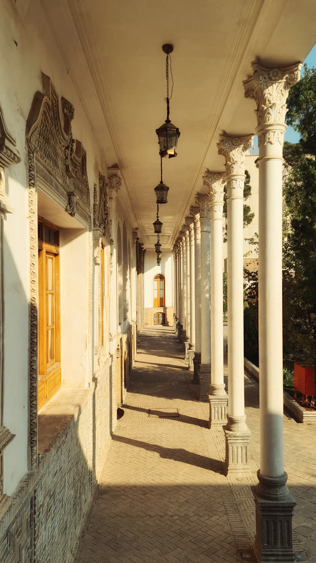 Colonnade with ornate columns and hanging lanterns