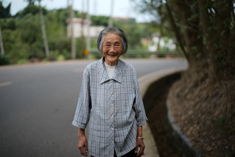 Senior walking confidently outdoors during post-surgery recovery
