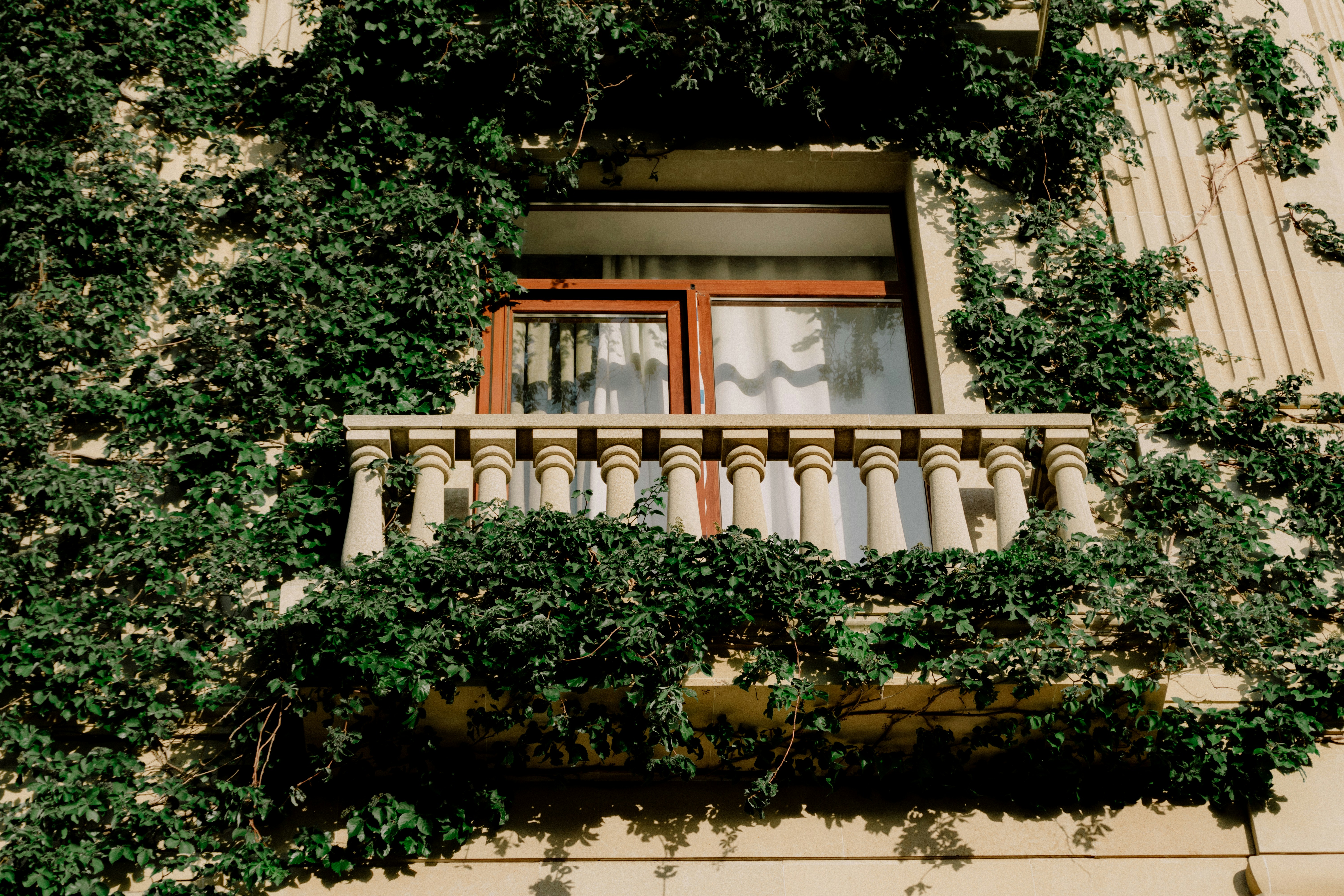 A tiny figure trying to climb a sheer, impossibly tall skyscraper, representing a startup chasing a huge enterprise.