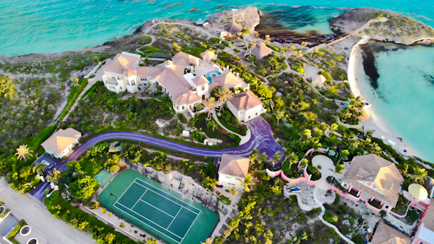 Luxury villa with tennis court on tropical island