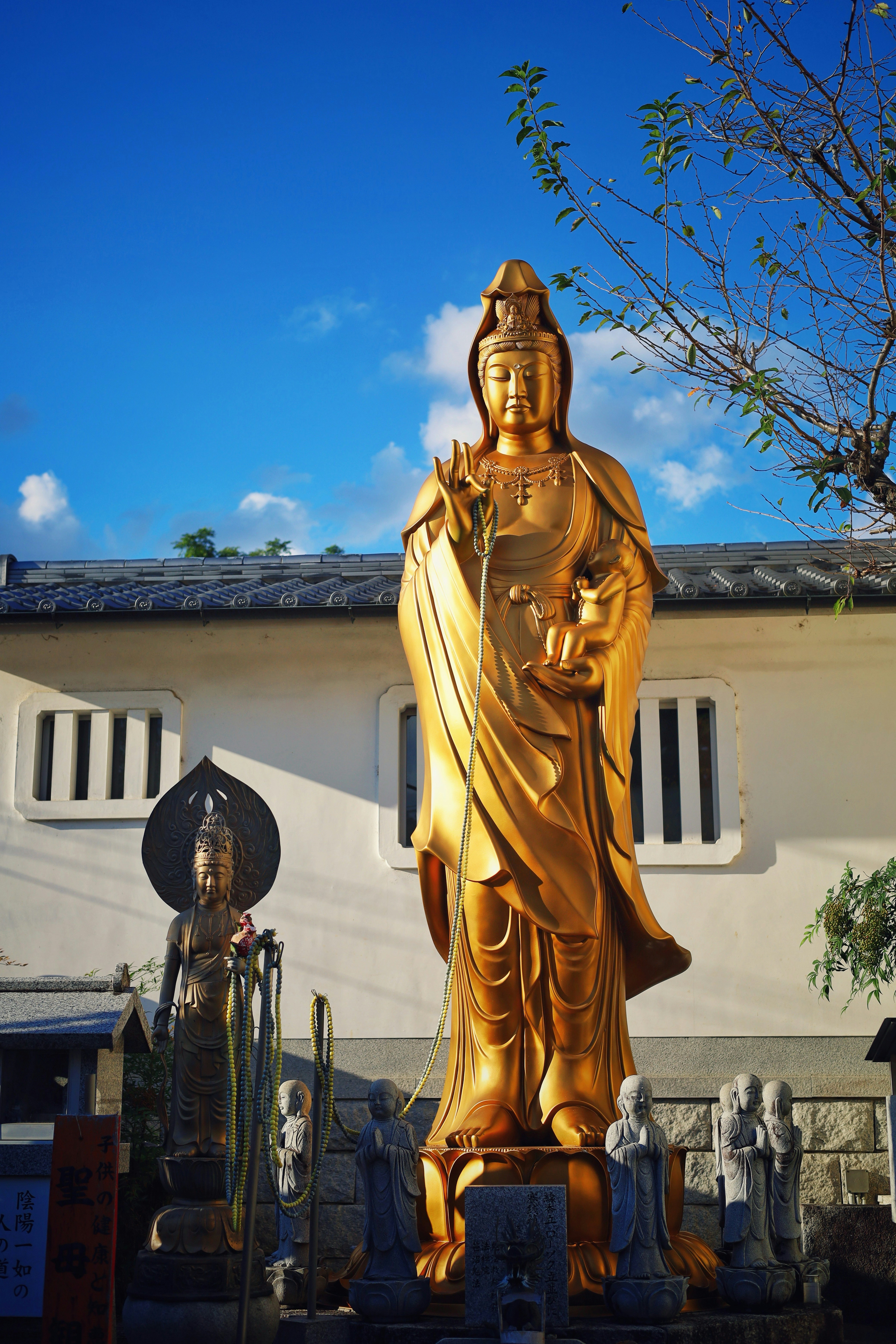Golden statue of a buddhist deity outdoors