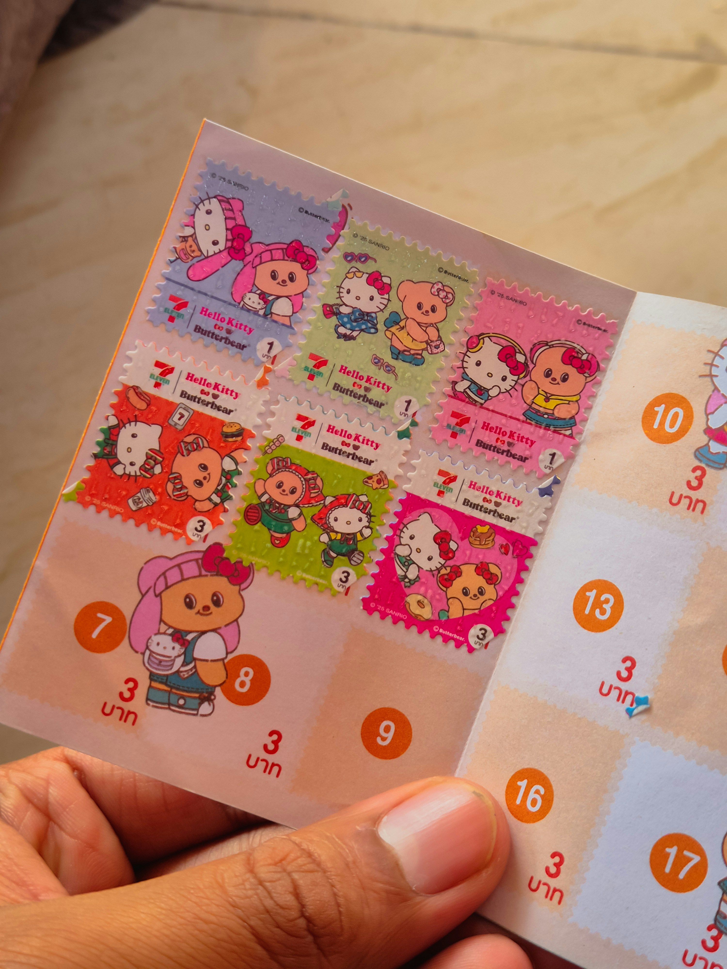 Sheet of hello kitty stamps with various designs.