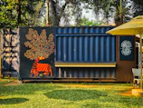 Shipping container converted into a kiosk with mural