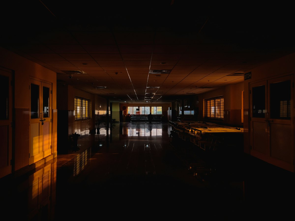 Quiet hospital corridor at night with soft light — Monday blessings for night shift workers