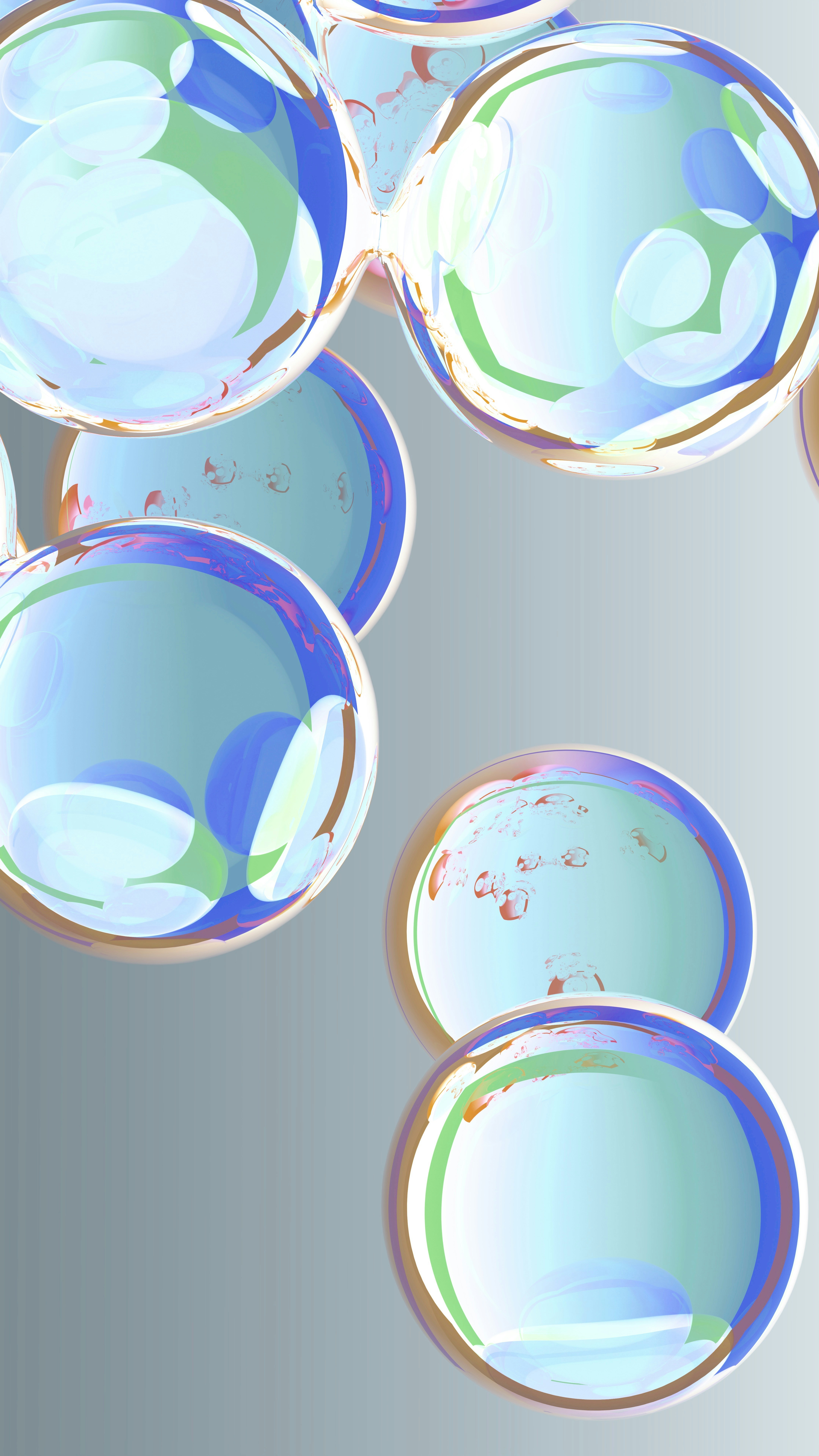 Abstract colorful bubbles floating against a gray background