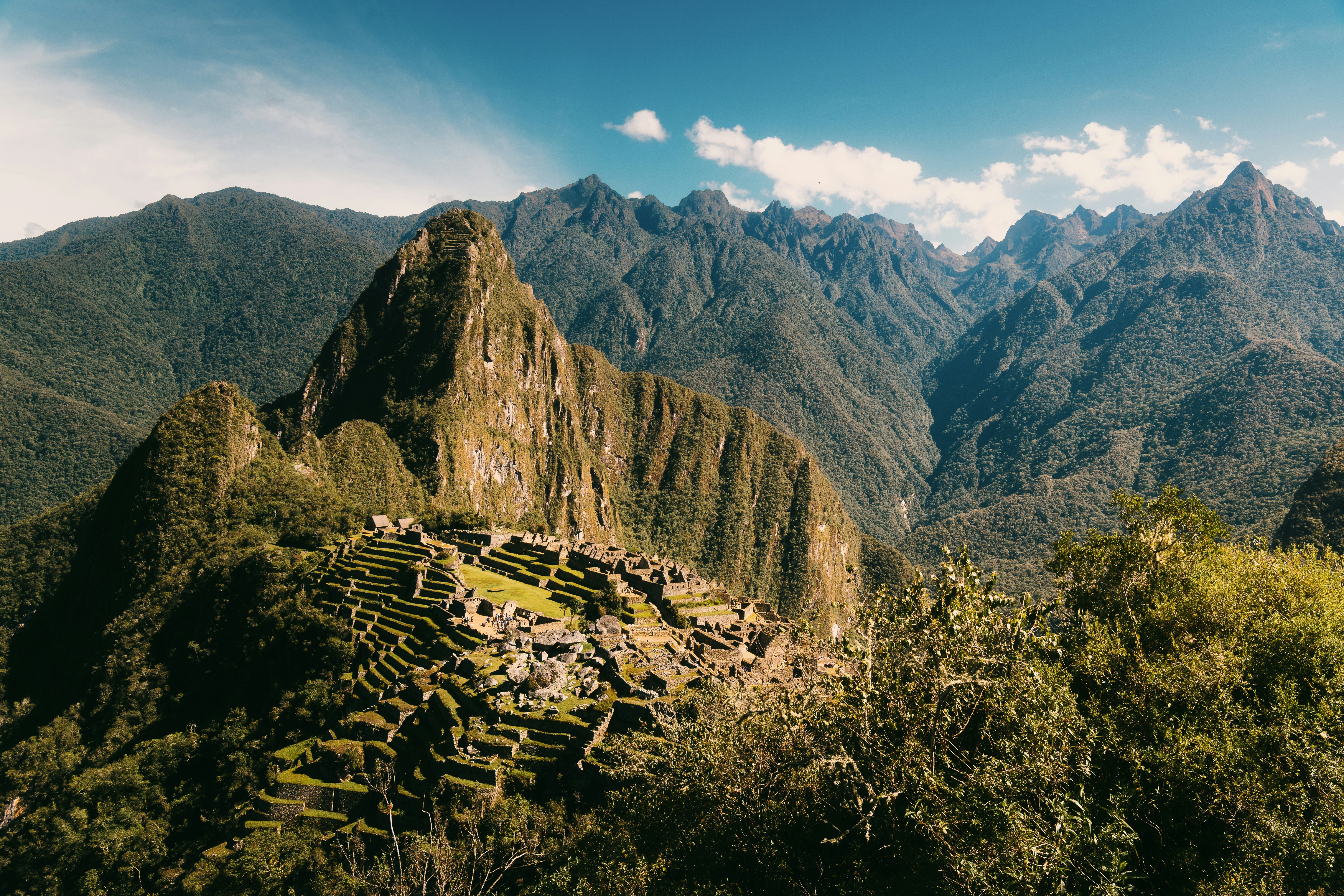 Ancient inca ruins nestled in lush green mountains.