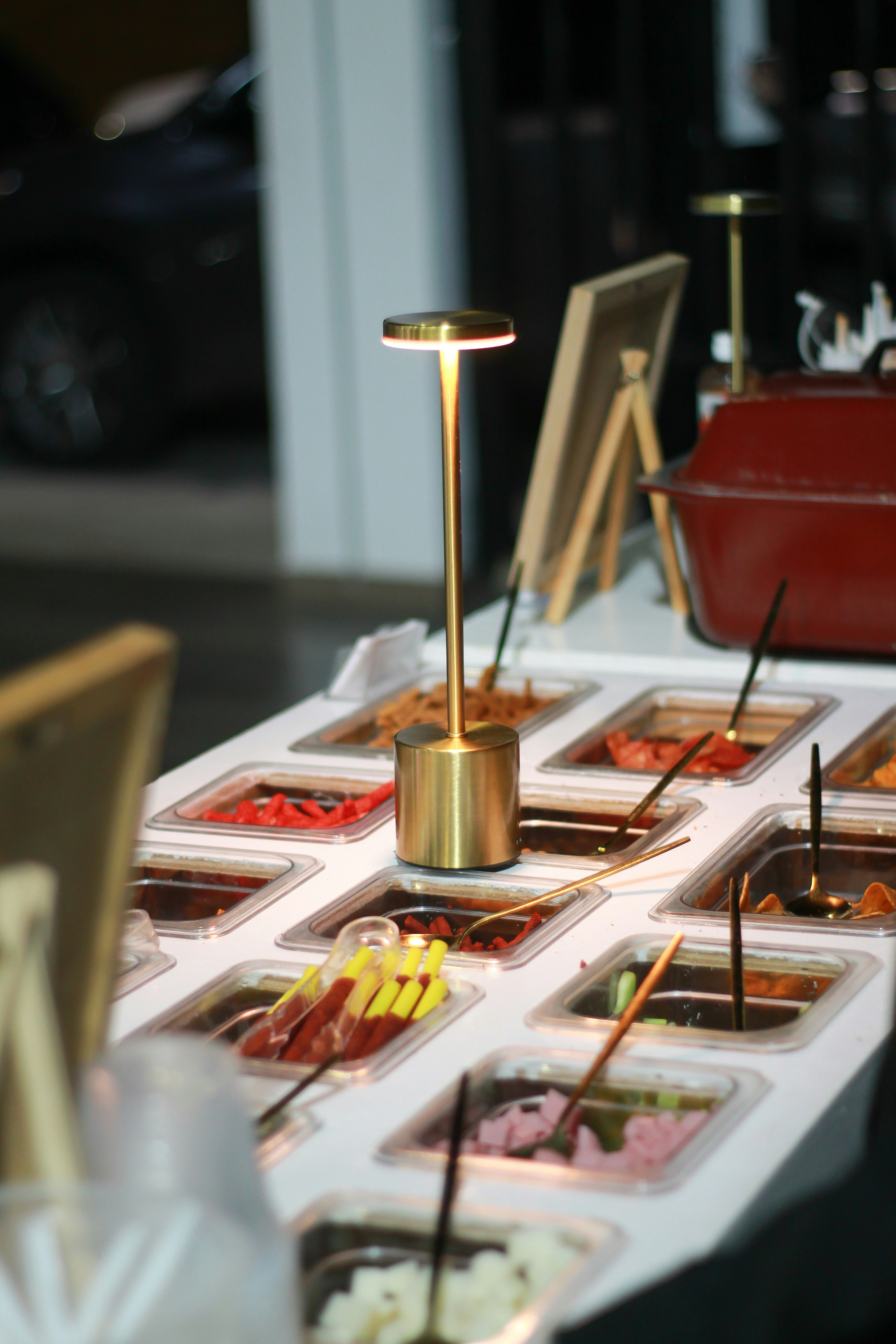 Toppings bar with various colorful ingredients.