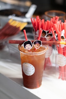 A festive drink with candy and child faces.