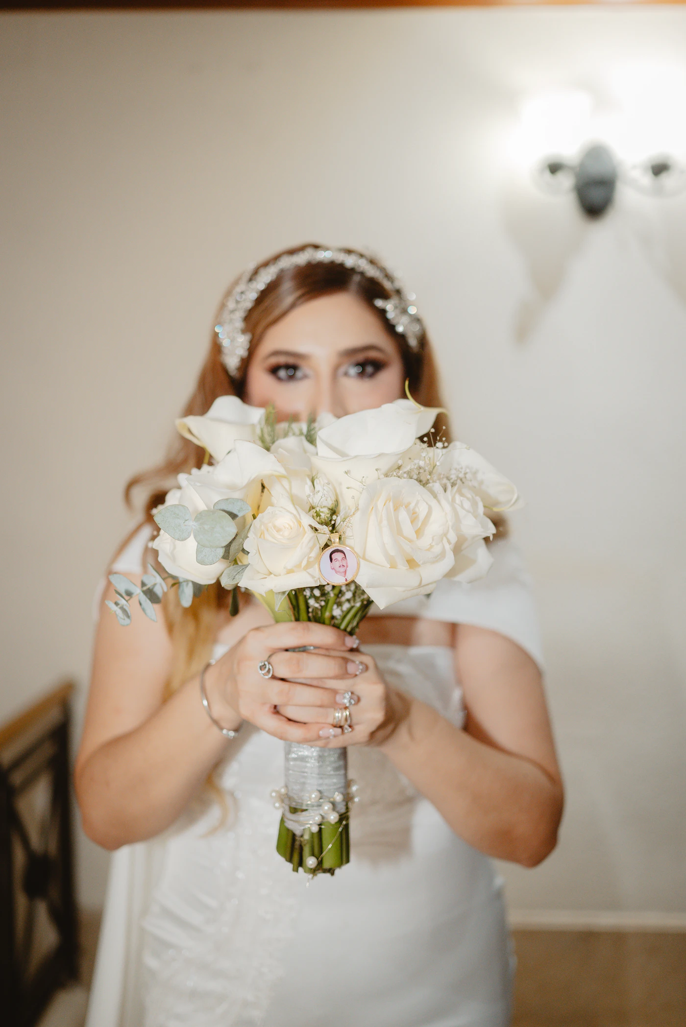 Wedding dress necklines for petite body types — A petite bride in a V-neck wedding dress that elongates her frame.