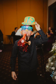 Boy wearing silly party glasses and hat