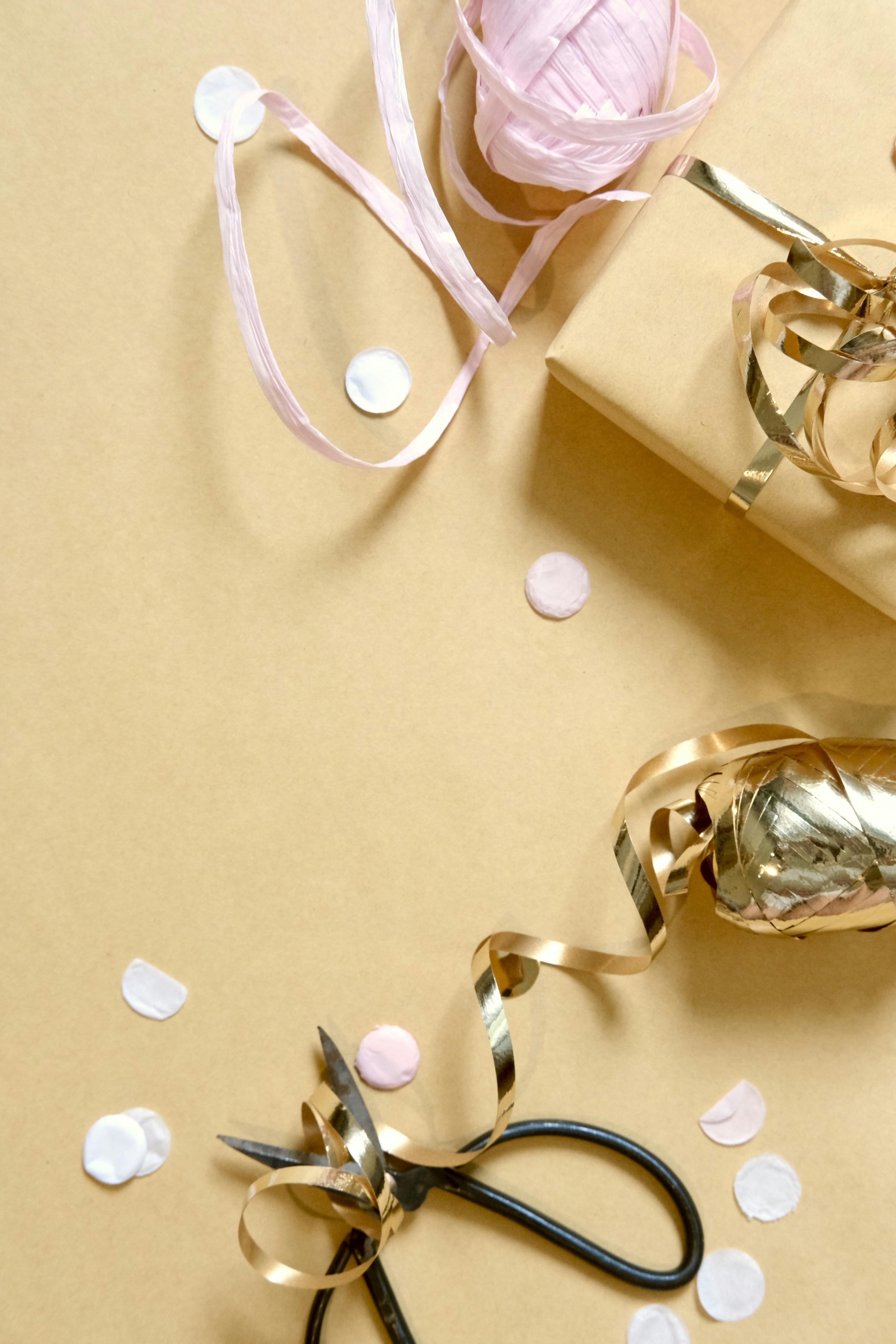 Gift wrapping supplies with scissors and confetti