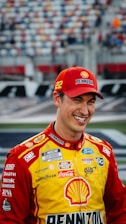 Nascar driver joey logano smiles on the track
